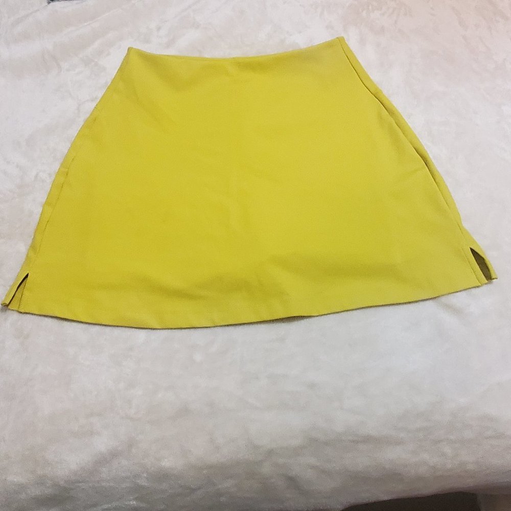 Girlfriend Collective Bright yellowish green skort.  Size medium
